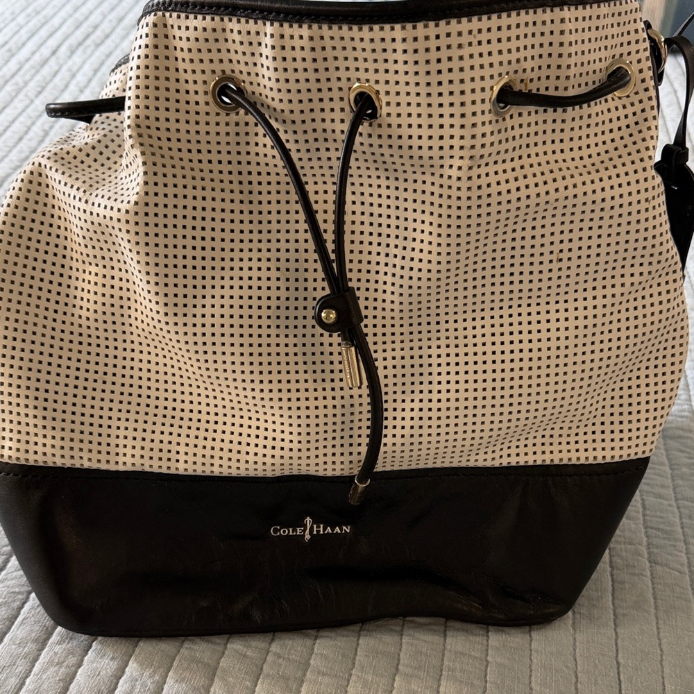 Cole Haan Black and Cream Perforated Drawstring Bucket Shoulder Bag